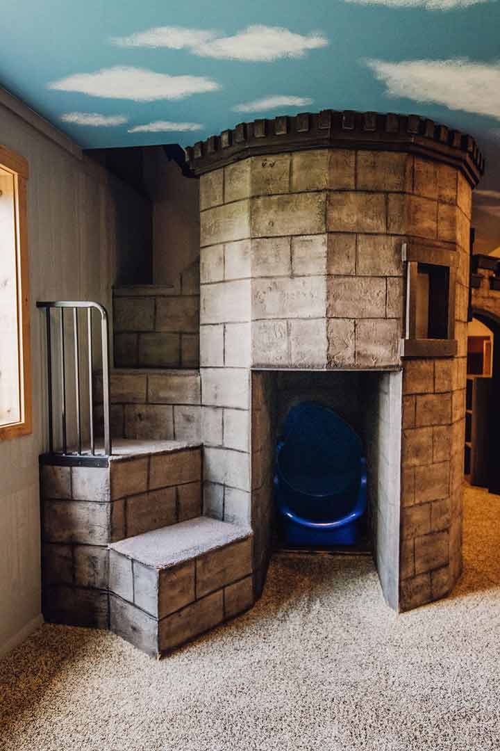 Indoor castle play structure with slide