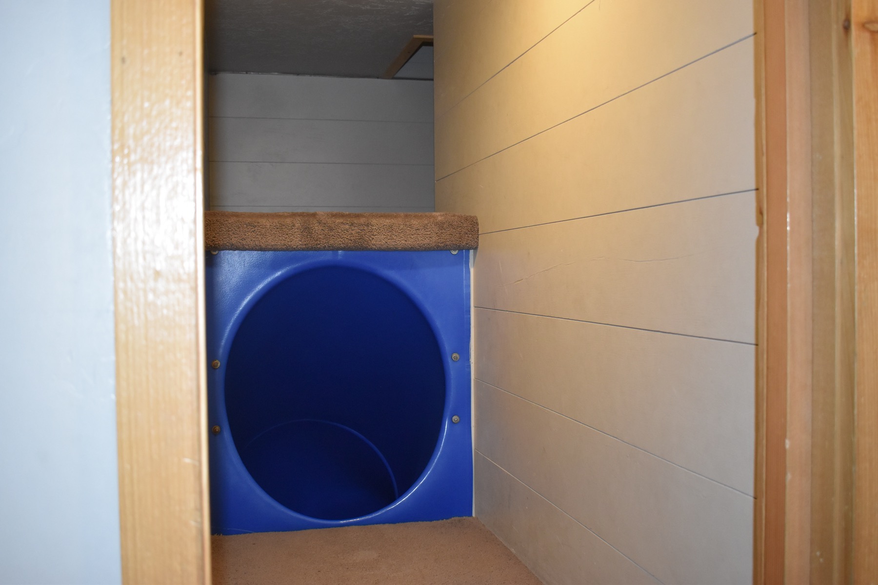 Blue crawl tunnel connecting the kids’ playrooms