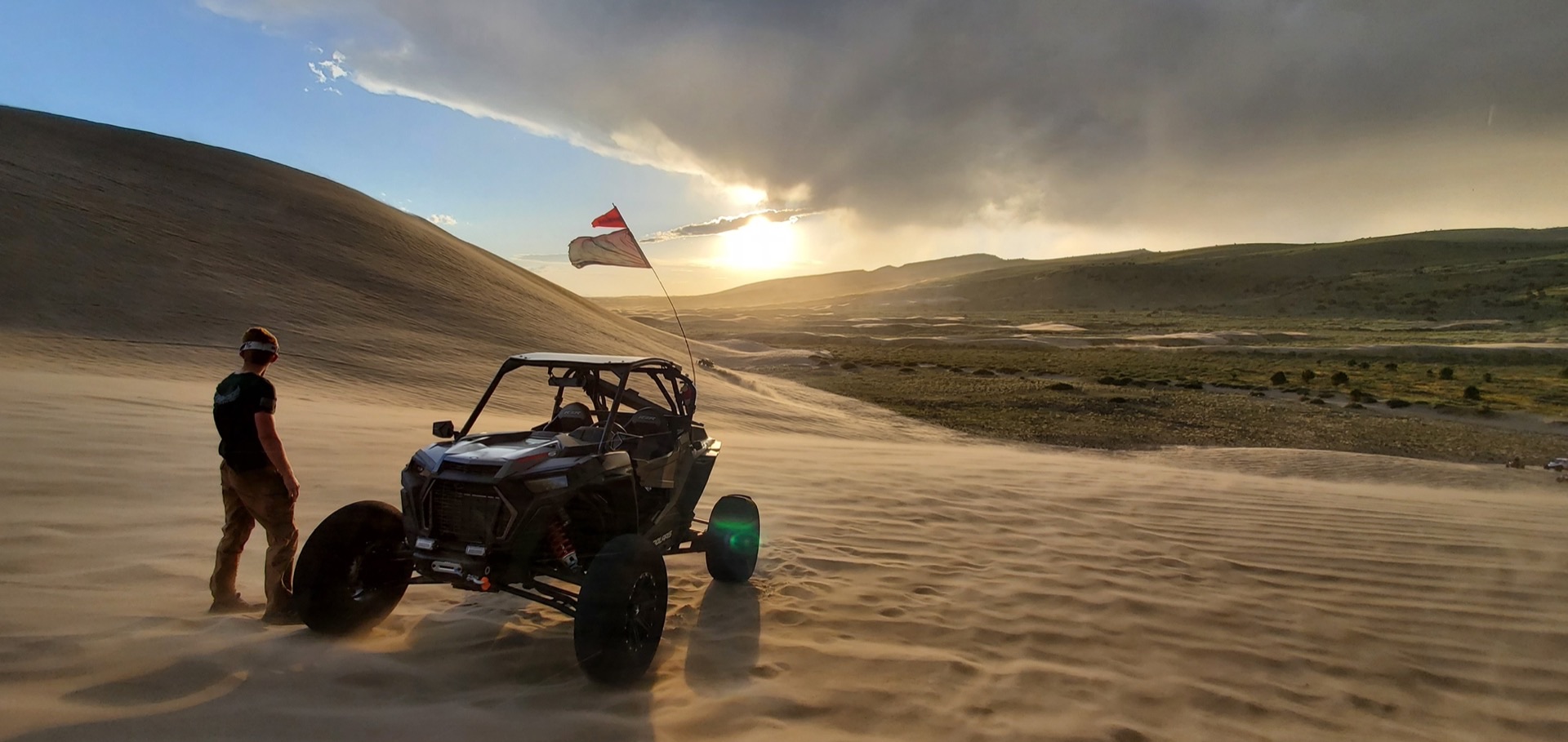 Golden-hour light and wind across the Saint Anthony Sand Dunes